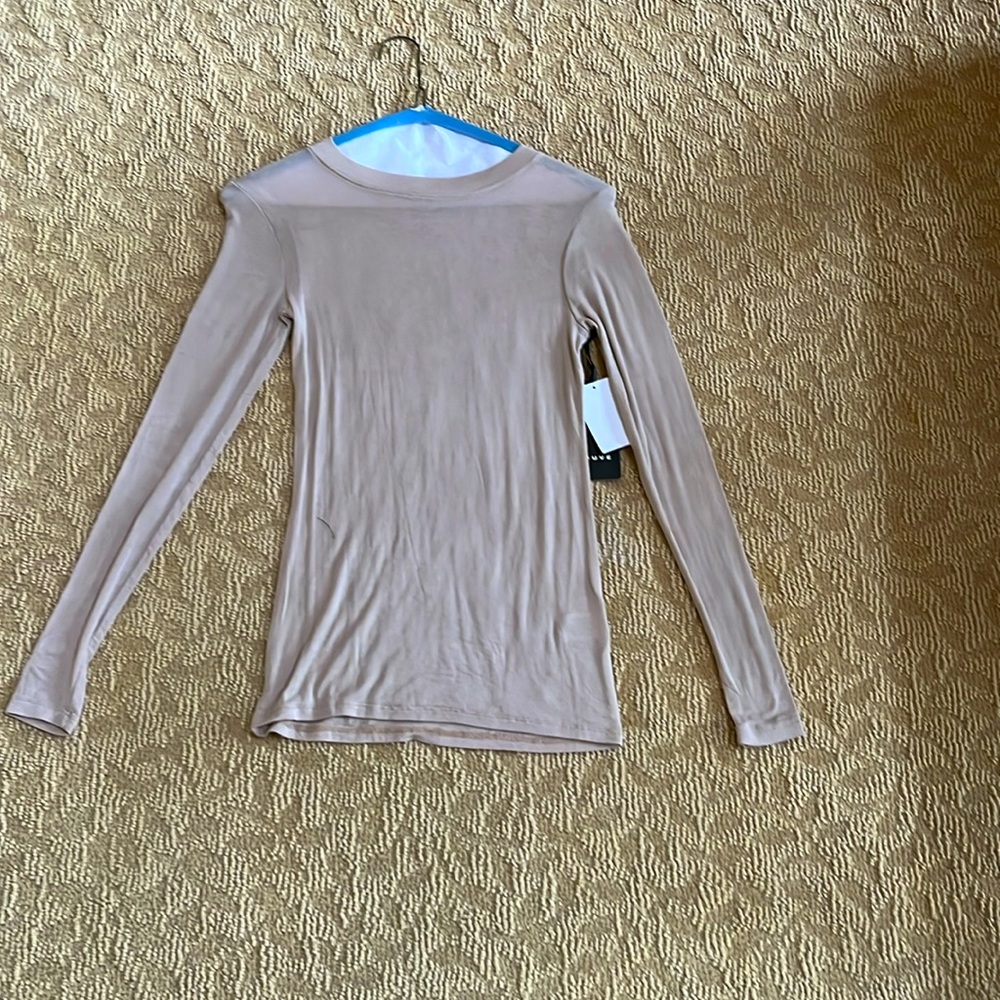 Woman’s tan semi sheer top